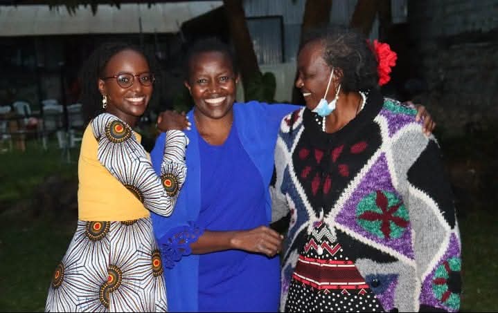 Three generations of a Kenyan family smiling together